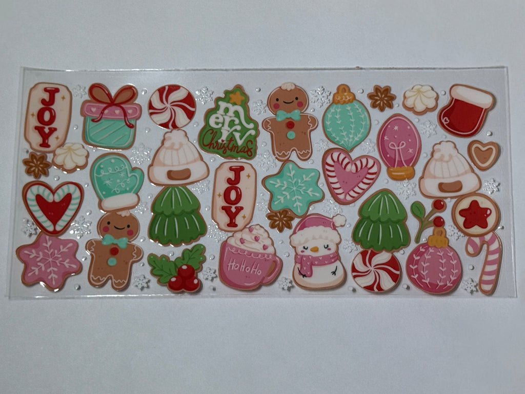 Collection of Christmas-themed cookies on a white card with a gold foil background