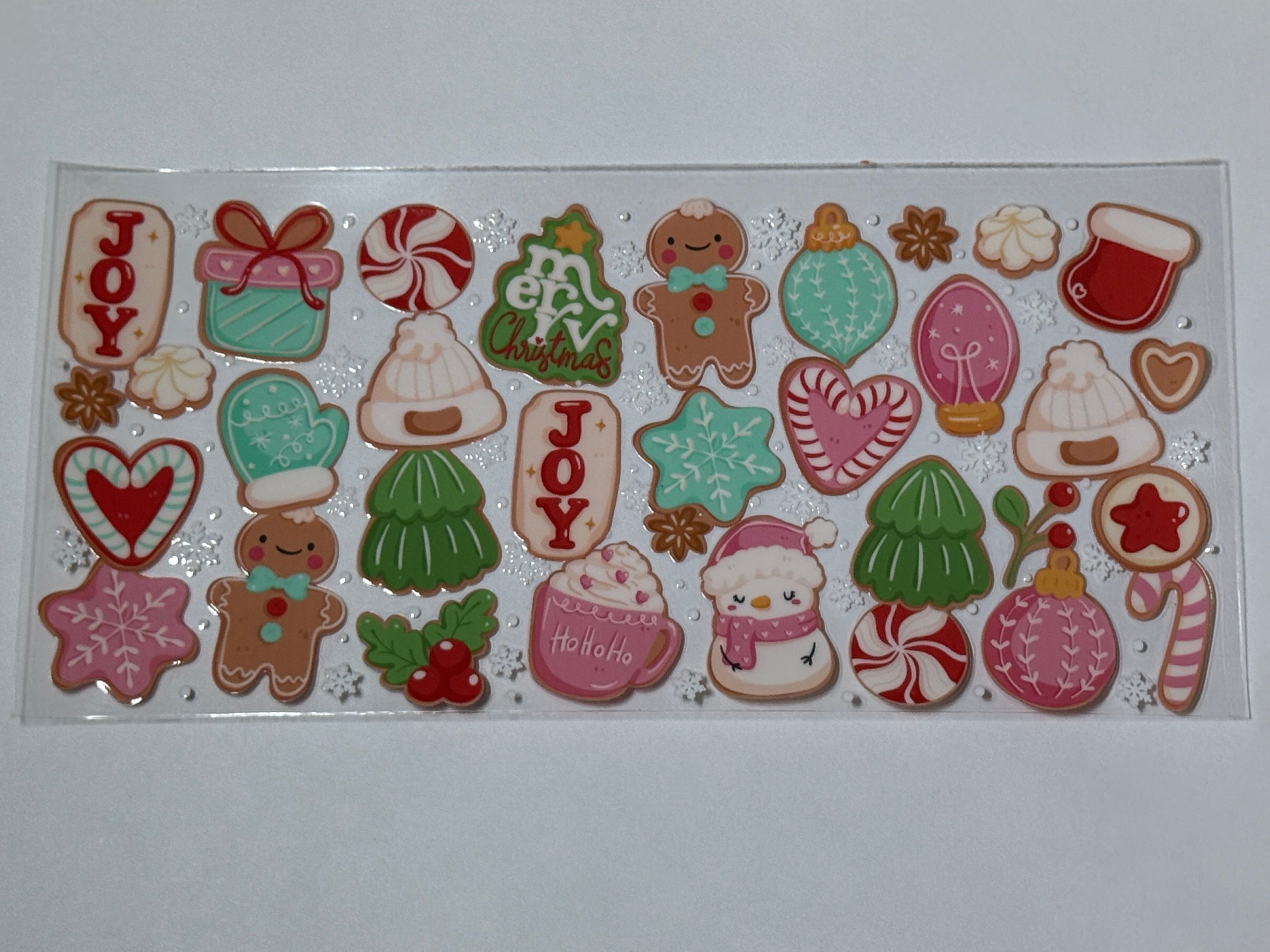 Collection of Christmas-themed cookies on a white card with a gold foil background
