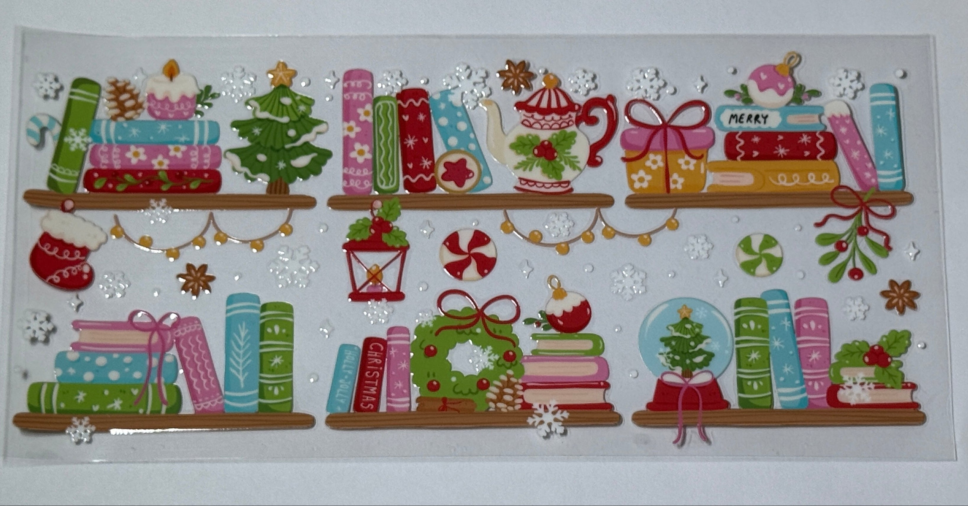 Decorative Christmas-themed stickers with books, trees, and presents on a white background.